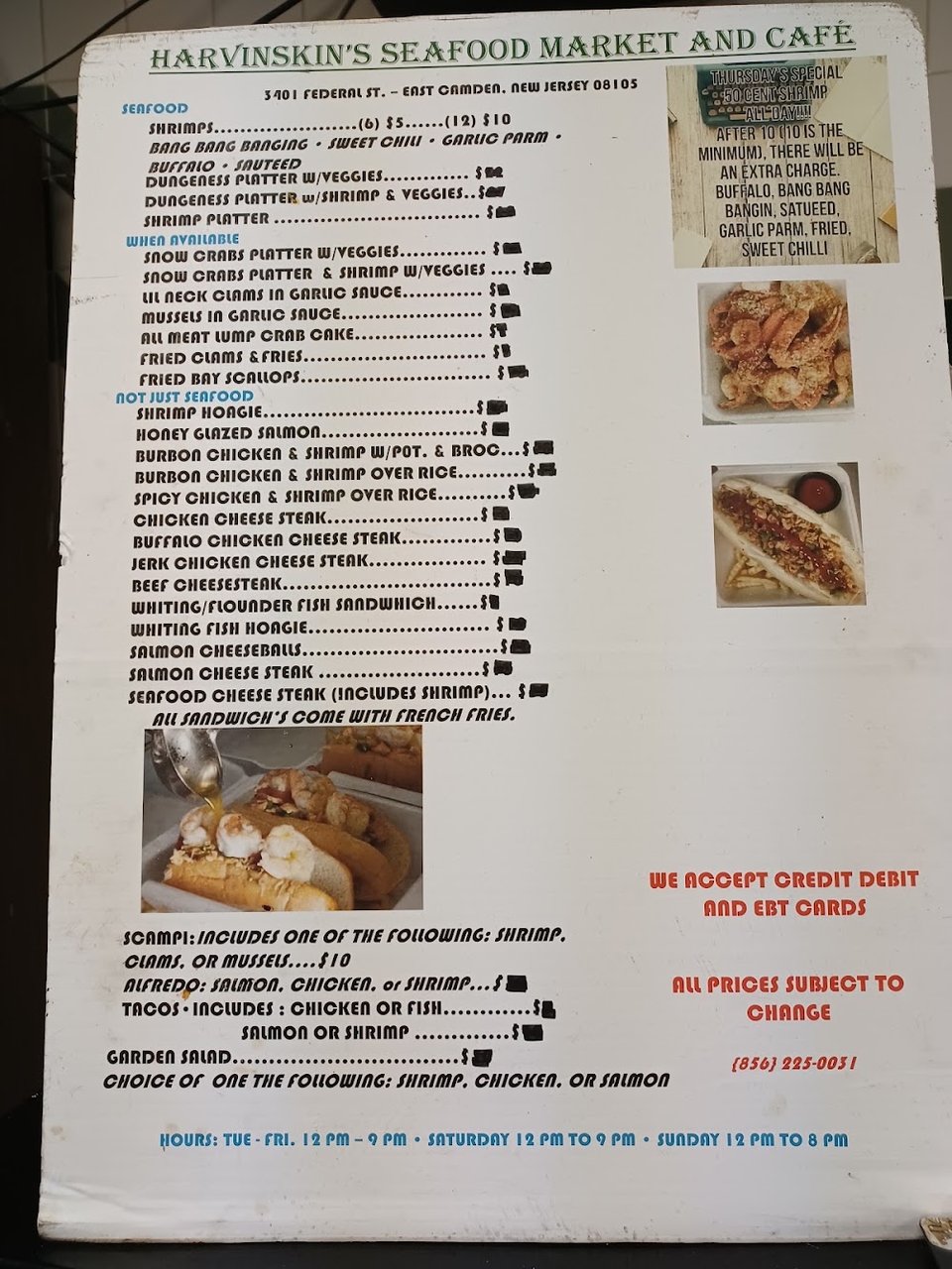 Menu board with seafood, chicken, and sides.