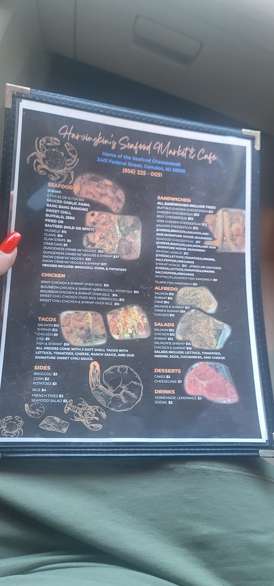 Restaurant menu with eggrolls, clams, and platters.